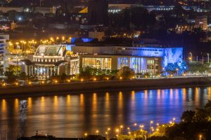 MÜPA (Palace of Arts) and National Theatre illuminated at night over the Danube in Budapest